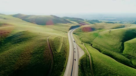 peaceful california road winds through lush green hills on way to san francisco