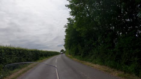 Car-cutting-corner-on-bend-dangerous-just-misses-motorcycle-