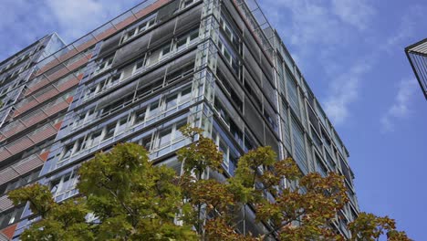 modern building in kiel, germany, with glass facade against a bright blue sky on a clear day