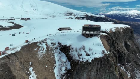 Russian-Georgian-Friendship-Monument-On-Georgian-Military-Road-Near-Gudauri,-Georgia---aerial-drone-shot