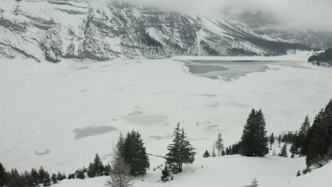 Aerial-overview-of-frozen-lake-in-vast-winter-wilderness