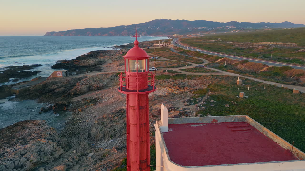 Drone lighthouse tower placed on picturesque seashore at summer evening.