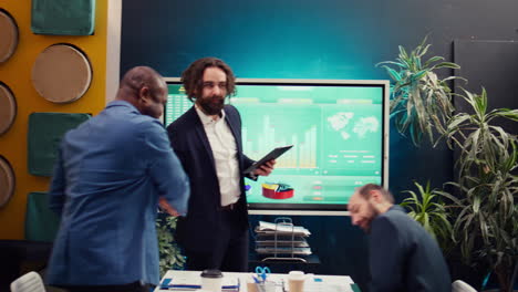 project manager welcoming his team in business meeting