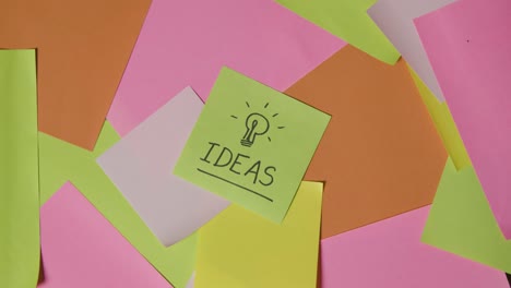 Business-Concept-Of-Revolving-Sticky-Notes-With-Ideas-Written-On-Top-Note