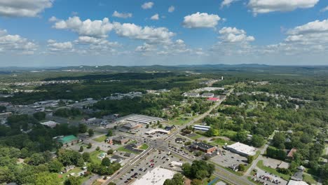 rural junction in american suburb during sunny day with puffy clouds