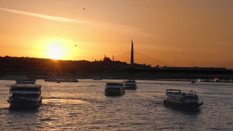 cityscape of istanbul at sunset, turkey. the bosphorus strait with boats, embankment street, rows of residential buildings, mosques