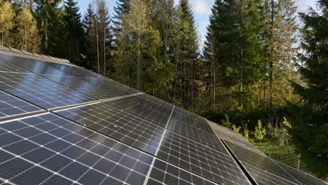 aerial tilt shot low over the surface of solar cells on a house roof, fall day