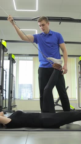 physical therapy session: leg stretching