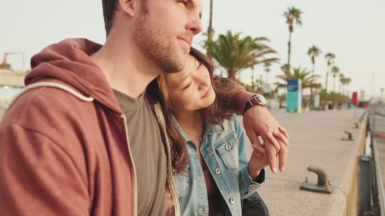 Affectionate Couple Embracing and Holding Hands Outdoors