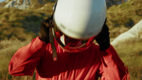 astronaut wears helmet and observes the clearing in the new planet