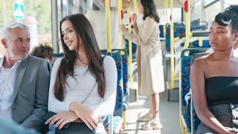 older man in suit returns from work by bus, guy sits next to beautiful attractive