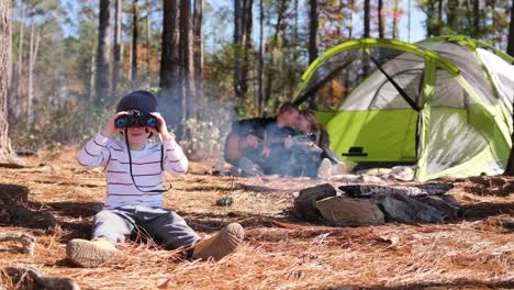 a boy explores woods with binoculars discovering natures wonders a young boy explores the serene woods with binoculars capturing glimpses of wildlife and the beauty of nature inviting viewers to join his adventure