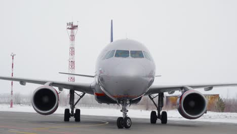 airplane on the ground at the airport in winter