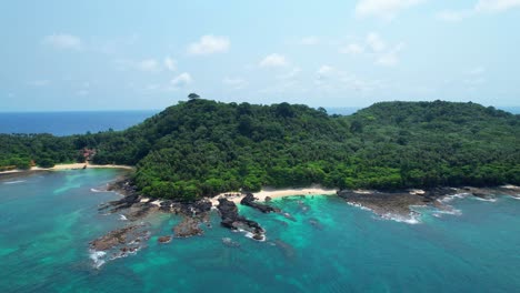 Aerial-Circling-view-from-coffe-beach-at-Ilheu-das-Rolas-island-in-Sao-Tome,-Africa