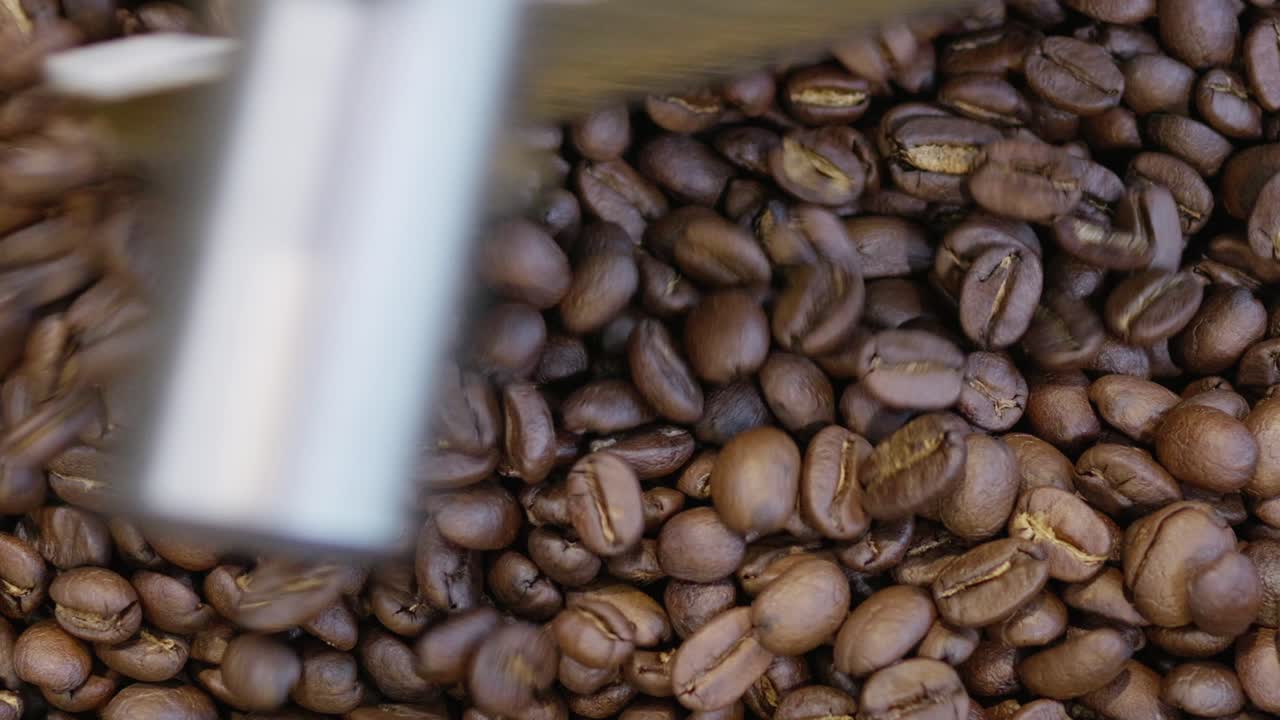 Discover the rich textures and colors of coffee beans capturing the essence of brewing in a warm kitchen.