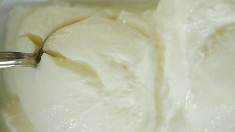 close-up of vanilla ice cream being scooped