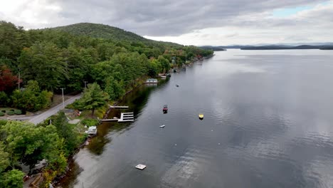 aerial view of a serene lake with houses and boats