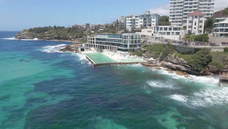 bondi icebergs pool at the famous bondi beach with few people swims at daytime during pandemic in sydney, nsw australia