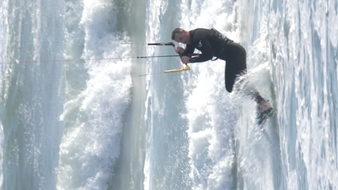 Kitesurfer Riding Waves in the Ocean