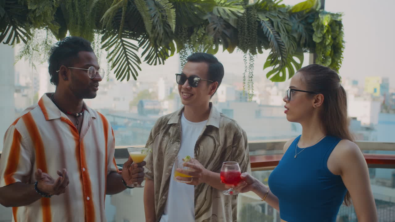 Friends Clinking Glasses when Celebrating with Cocktails in Cafe