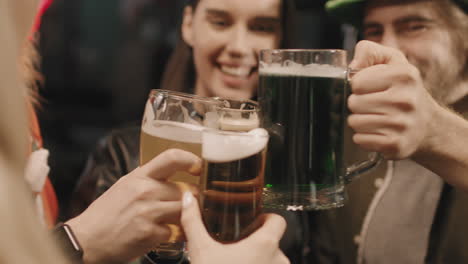 friends celebrating st patricks day together in pub
