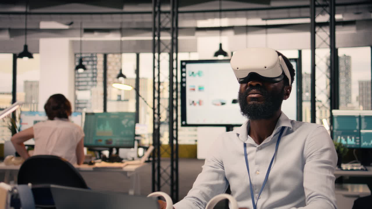 African American man, interacting with VR goggles, multinational company office
