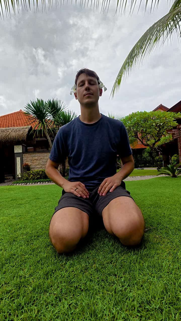 Man learning silent meditation yoga wellness retreat in Bali Southeast Asia