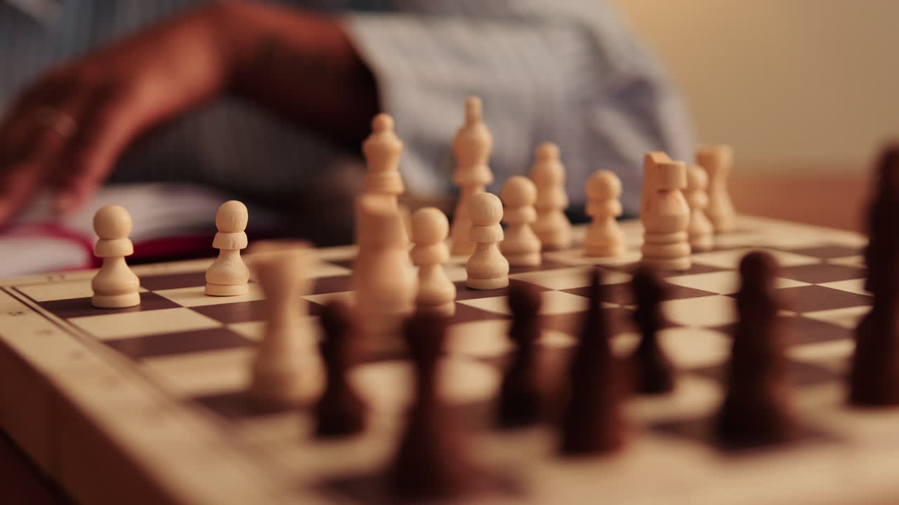 Chess Player Makes Strategic Move on Wooden Board