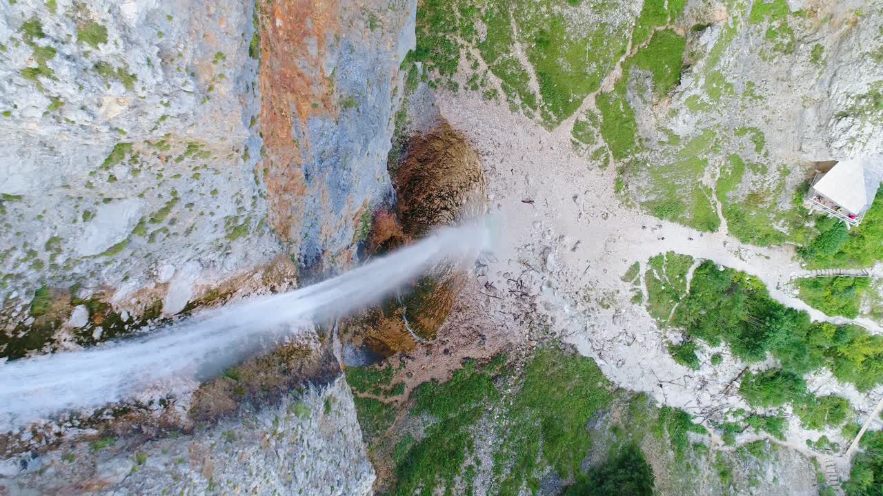 Aerial top raising view of Rinka waterfalls in Logar valley, Slovenia