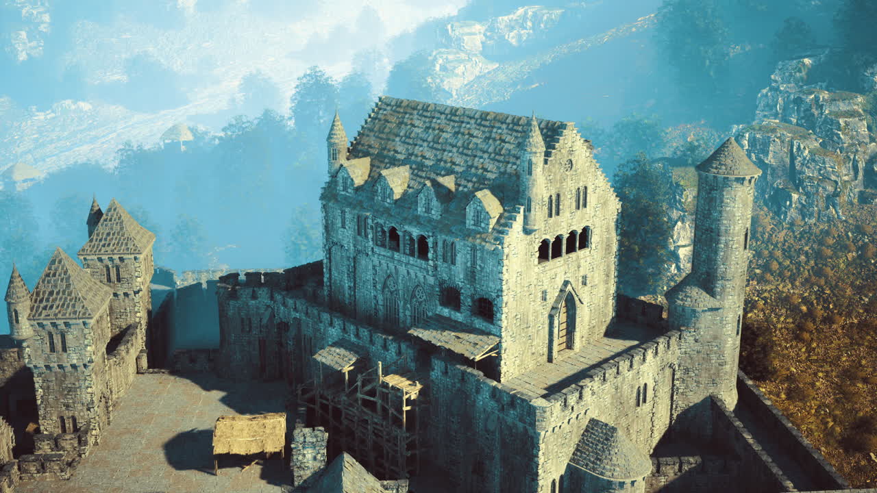 Castle ruins under morning mist in a mountainous landscape during autumn