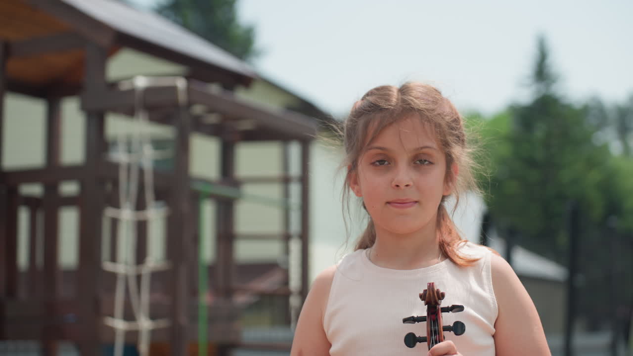 Young Woman Stands Proudly With Violin On Porch, Poised Girl Confidently Holding Violin On Welcoming Porch, Young Woman With Violin Posing Confidently On Wooden Porch In Suburban Setting