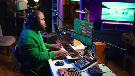 Young-artist-playing-piano-keys-and-singing-song-on-microphone