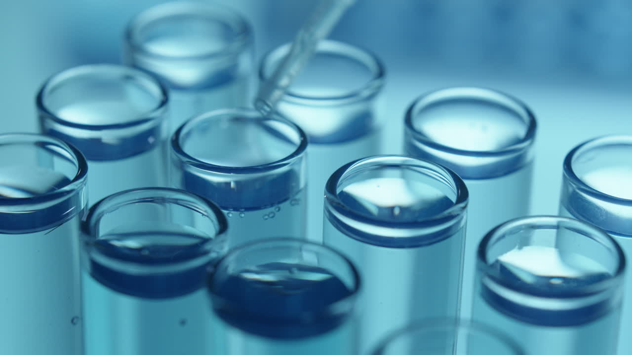 Dripping Liquid into Test Tubes with Glass Pipette during Lab Research