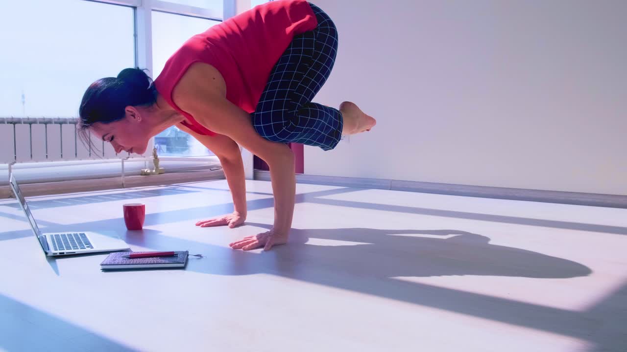 A Journey of Transformation: Witness the Evolution of Focus and Strength as a Dedicated Individual Transitions from Meditation to an Impressive Yoga Pose in a Bright, Minimalist Space