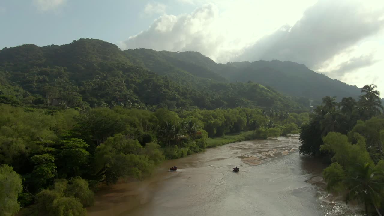 ATVs Crossing Shallow Water Of Tuito River In Yelapa, Jalisco, Mexico - aerial drone shot