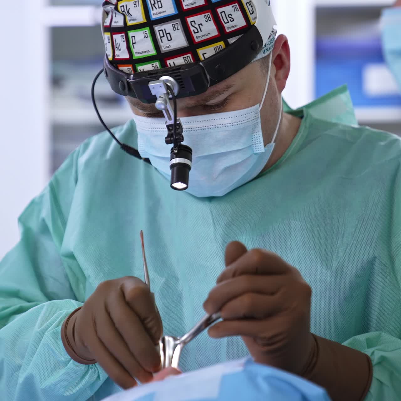 Focused surgeon applies tools to a patient's nose. Doctor with device on his head conducts nasal septum operation