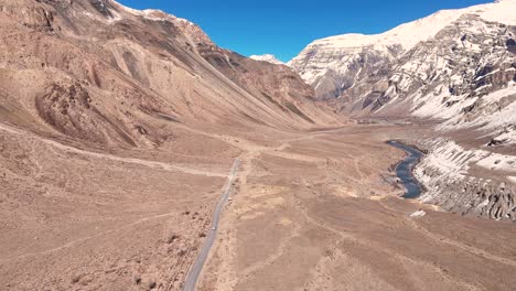 Aerial View of a Mountain Valley with Road and River