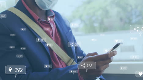 animation of media notifications and african american man in face mask using smartphone on bus