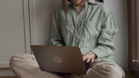 woman working on laptop at home