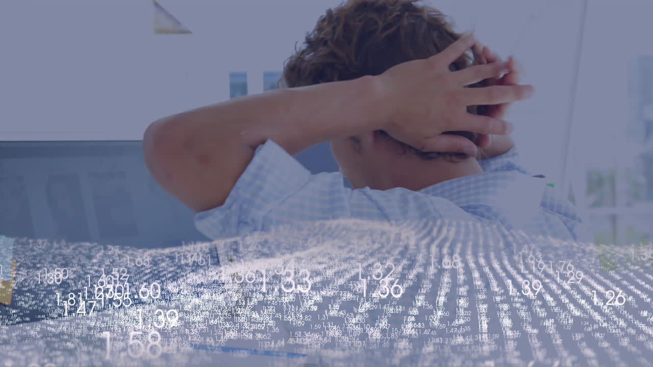 business analyst analyzing data on dual monitors, showing floating white numeric grids