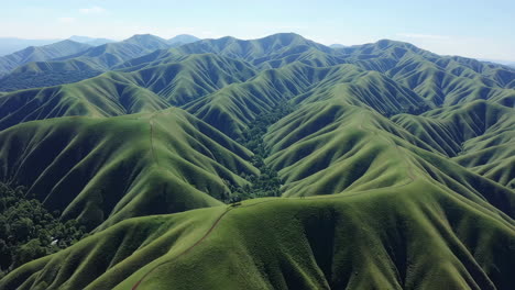 aerial view of rolling green hills