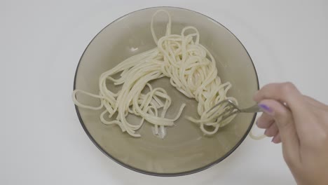 uncooked spaghetti in a bowl