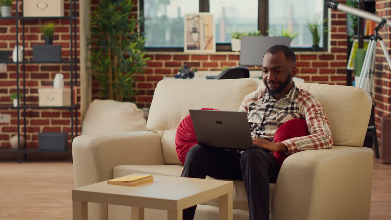 Boyfriend and girlfriend watching video on laptop together