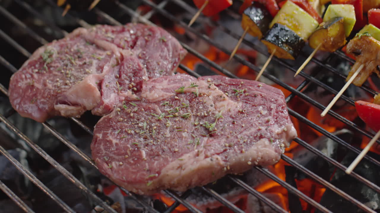 Beef Steaks and Veggie Skewers on BBQ