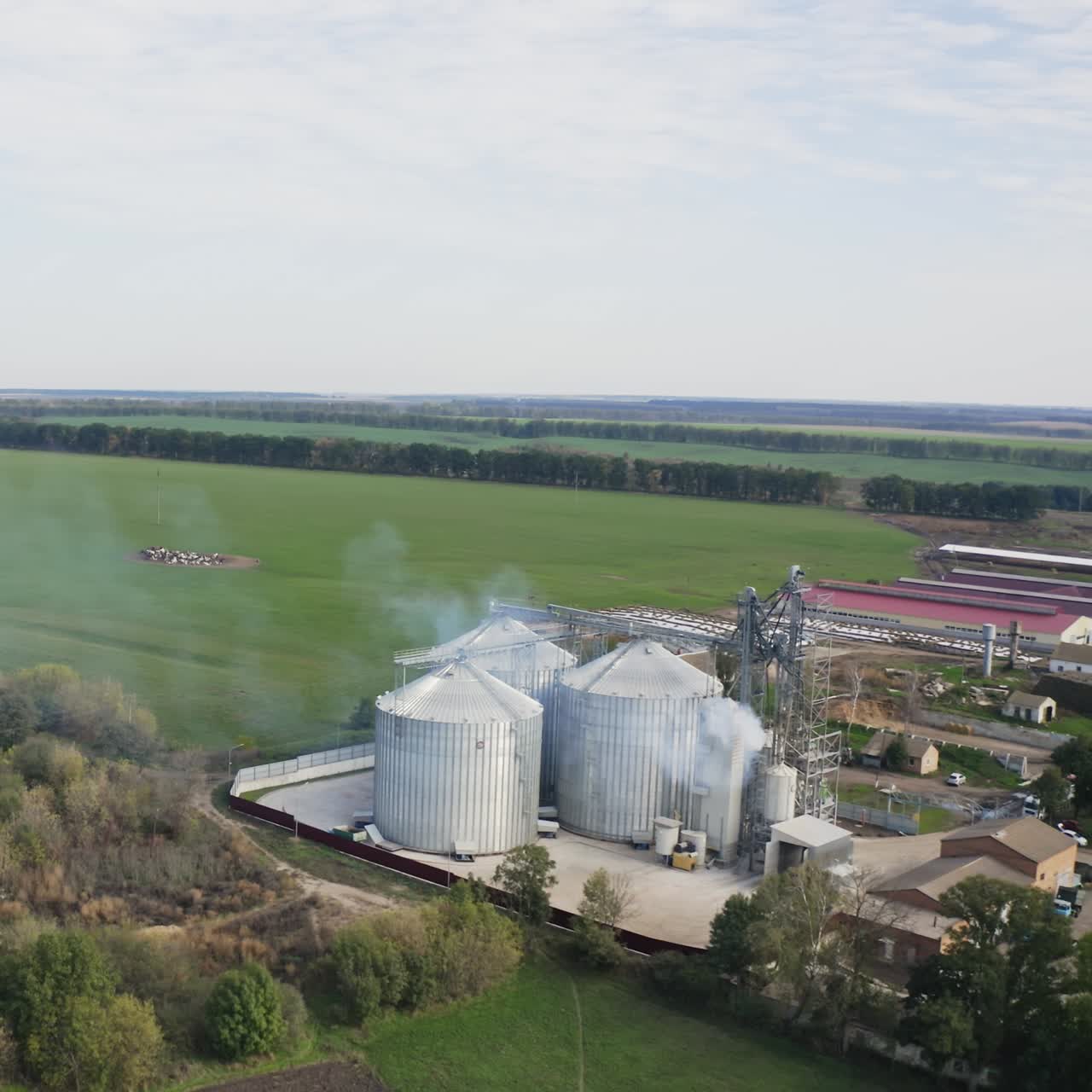 Tanks granary farming elevator. Factory agricultural elevator aerial view