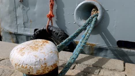 close up ship bow hawser rope on strong mooring bollard sozopol harbour