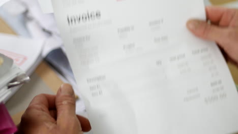 close up of a man opening debt letters