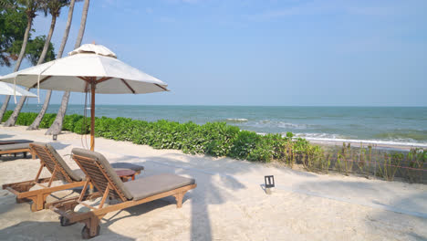 umbrella with beach chair and ocean sea background - holiday and vacation concept