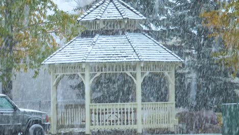 snow falling on a gazebo located in steamboat springs colorado