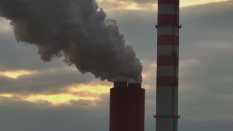 power plant smokestacks at sunrise/sunset